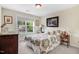 Bedroom featuring a bright window, side tables, and a dresser at 74 Fountain Dr, Clayton, NC 27520