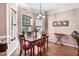 Bright breakfast nook with hardwood floors, natural light, and modern chandelier at 74 Fountain Dr, Clayton, NC 27520