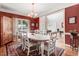 Formal dining room with hardwood floors, area rug, and traditional furnishings at 74 Fountain Dr, Clayton, NC 27520