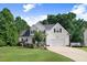 Charming two-story home with a well-manicured lawn, beautiful landscaping, and an attached two-car garage at 74 Fountain Dr, Clayton, NC 27520