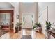 Bright foyer with hardwood floors, high ceilings, and ample natural light creating a welcoming entrance at 74 Fountain Dr, Clayton, NC 27520