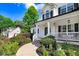 Inviting front porch with classic columns, manicured landscaping, and a welcoming entrance at 74 Fountain Dr, Clayton, NC 27520