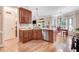 Spacious kitchen with wood cabinets, stainless steel appliances, and hardwood flooring at 74 Fountain Dr, Clayton, NC 27520