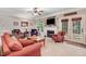 Comfortable living room with a fireplace, TV, and access to the outdoor patio at 74 Fountain Dr, Clayton, NC 27520