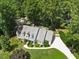 Aerial view of a well-maintained home with a spacious yard and mature trees at 7917 Rooksley Ct, Raleigh, NC 27615