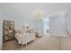Bedroom with two twin beds, modern lighting fixture, large windows and plenty of storage at 7917 Rooksley Ct, Raleigh, NC 27615
