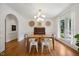 Dining room with natural light, stylish decor, and ample seating at 7917 Rooksley Ct, Raleigh, NC 27615