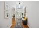 Spacious foyer featuring a decorative rug, bench seating, and high ceilings at 7917 Rooksley Ct, Raleigh, NC 27615