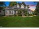 Charming single-Gathering home featuring a welcoming front porch and well-manicured lawn at 7917 Rooksley Ct, Raleigh, NC 27615