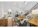 Bright living room with fireplace, high ceilings and staircase at 7917 Rooksley Ct, Raleigh, NC 27615