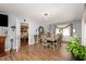 Spacious dining room with elegant furniture, hardwood floors, and ample natural light at 810 Grovemont Rd, Raleigh, NC 27603