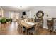 Cozy dining area featuring gray walls, wood-look tile floors, and a stylish wooden dining table at 810 Grovemont Rd, Raleigh, NC 27603