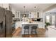 Beautiful kitchen with white cabinetry, stainless steel appliances, and a functional island at 810 Grovemont Rd, Raleigh, NC 27603