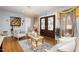 Bright living room showcasing hardwood floors, sophisticated decor, and a comfortable seating area at 810 Grovemont Rd, Raleigh, NC 27603