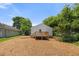 The home's backyard features a newly installed wooden deck, perfect for outdoor entertaining and relaxation at 810 Williams St, Burlington, NC 27217