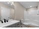 Modern bathroom with a gray vanity and a shower-tub combo at 810 Williams St, Burlington, NC 27217