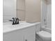 Bright bathroom with modern vanity, matte black faucet, and a shower-tub combo at 810 Williams St, Burlington, NC 27217