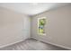 Neutral bedroom with a window view of the outdoors at 810 Williams St, Burlington, NC 27217