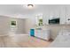 This newly renovated kitchen has white cabinets, a black sink and a modern, blue dishwasher at 810 Williams St, Burlington, NC 27217