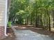 Large backyard featuring mature trees and greenery providing privacy and natural beauty at 8100 Laurel Mountain Rd, Raleigh, NC 27613