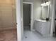 Bathroom with a modern vanity, and a view to the closet at 8100 Laurel Mountain Rd, Raleigh, NC 27613