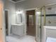 Bathroom showcasing a glass-enclosed shower, vanity, tub, and connections to other rooms at 8100 Laurel Mountain Rd, Raleigh, NC 27613
