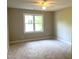 Neutral bedroom with ceiling fan at 8100 Laurel Mountain Rd, Raleigh, NC 27613