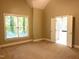 Bedroom with large window and ensuite bathroom at 8100 Laurel Mountain Rd, Raleigh, NC 27613