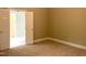 Bedroom with adjoining bath features neutral carpet and trim at 8100 Laurel Mountain Rd, Raleigh, NC 27613