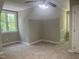 Neutral bedroom with ceiling fan and natural light at 8100 Laurel Mountain Rd, Raleigh, NC 27613