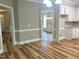 Open concept dining area with views into kitchen and living room at 8100 Laurel Mountain Rd, Raleigh, NC 27613