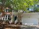 Charming home with brick and siding exterior, complemented by well-maintained landscaping and a two-car garage at 8100 Laurel Mountain Rd, Raleigh, NC 27613