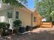Exterior shot of home with siding and trim, a deck, and a tree offering natural shade at 8100 Laurel Mountain Rd, Raleigh, NC 27613