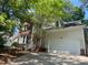 Charming home featuring mixed brick and vinyl siding, attached garage and a well-maintained yard with mature trees at 8100 Laurel Mountain Rd, Raleigh, NC 27613