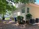 Property's exterior with bushes and air conditioning units at 8100 Laurel Mountain Rd, Raleigh, NC 27613