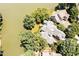 Bird's eye view of a distinguished home, showcasing meticulous landscaping and a serene lakeside location at 81002 Alexander, Chapel Hill, NC 27517
