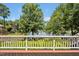 Tranquil backyard deck with a view of the lake and mature trees at 81002 Alexander, Chapel Hill, NC 27517