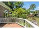Relaxing backyard deck overlooking the lake, surrounded by lush greenery at 81002 Alexander, Chapel Hill, NC 27517