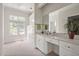 Bright bathroom featuring a vanity with white countertops and cabinets with gold hardware at 81002 Alexander, Chapel Hill, NC 27517
