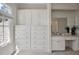 Well-organized bathroom featuring white cabinetry, drawers, and a vanity area, all bathed in natural light at 81002 Alexander, Chapel Hill, NC 27517