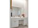 Bathroom vanity featuring storage with large mirror, lighting and simple decor at 81002 Alexander, Chapel Hill, NC 27517