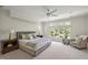 Cozy bedroom featuring a ceiling fan, nightstands, and natural light through large windows at 81002 Alexander, Chapel Hill, NC 27517