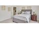 Comfortable bedroom with neutral tones, stylish decor, and a glimpse into an ensuite bathroom at 81002 Alexander, Chapel Hill, NC 27517