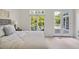 Sunlit bedroom with access to a private balcony and views of the surrounding trees and water at 81002 Alexander, Chapel Hill, NC 27517