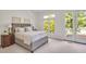 Serene bedroom with a large window and access to the outdoor deck, offering a peaceful retreat at 81002 Alexander, Chapel Hill, NC 27517