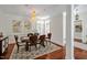 Elegant dining room with chandelier, stylish decor, and comfortable seating for formal meals at 81002 Alexander, Chapel Hill, NC 27517