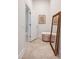 Hallway featuring decorative mirror and ottoman with access to other rooms at 81002 Alexander, Chapel Hill, NC 27517