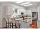 Bright kitchen featuring granite counters, a large island, stainless steel appliances, and ample cabinetry at 81002 Alexander, Chapel Hill, NC 27517