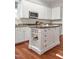 Beautiful kitchen island with extra shelves and cabinetry in a well-lit and modern space at 81002 Alexander, Chapel Hill, NC 27517
