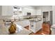 Elegant kitchen with granite countertops, ample cabinetry, hardwood floors, and stainless-steel appliances at 81002 Alexander, Chapel Hill, NC 27517